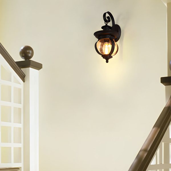 1-Light Seeded Glass Globe LED Outdoor Wall Lantern with Curved Arm - Image 4